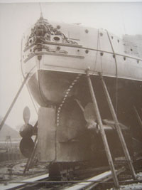 Shipyard scene show ornate and gilt decorationof HMS Victoria's sten